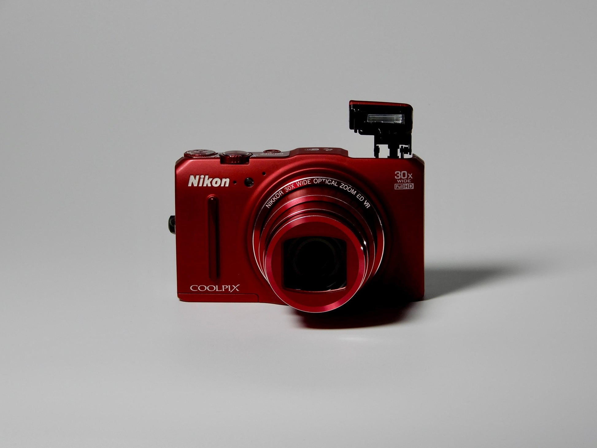 Red Nikon Coolpix S9700 / Digital Camera